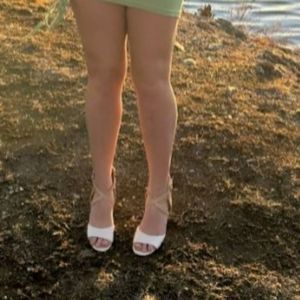 White and brown strapped ankle support heel